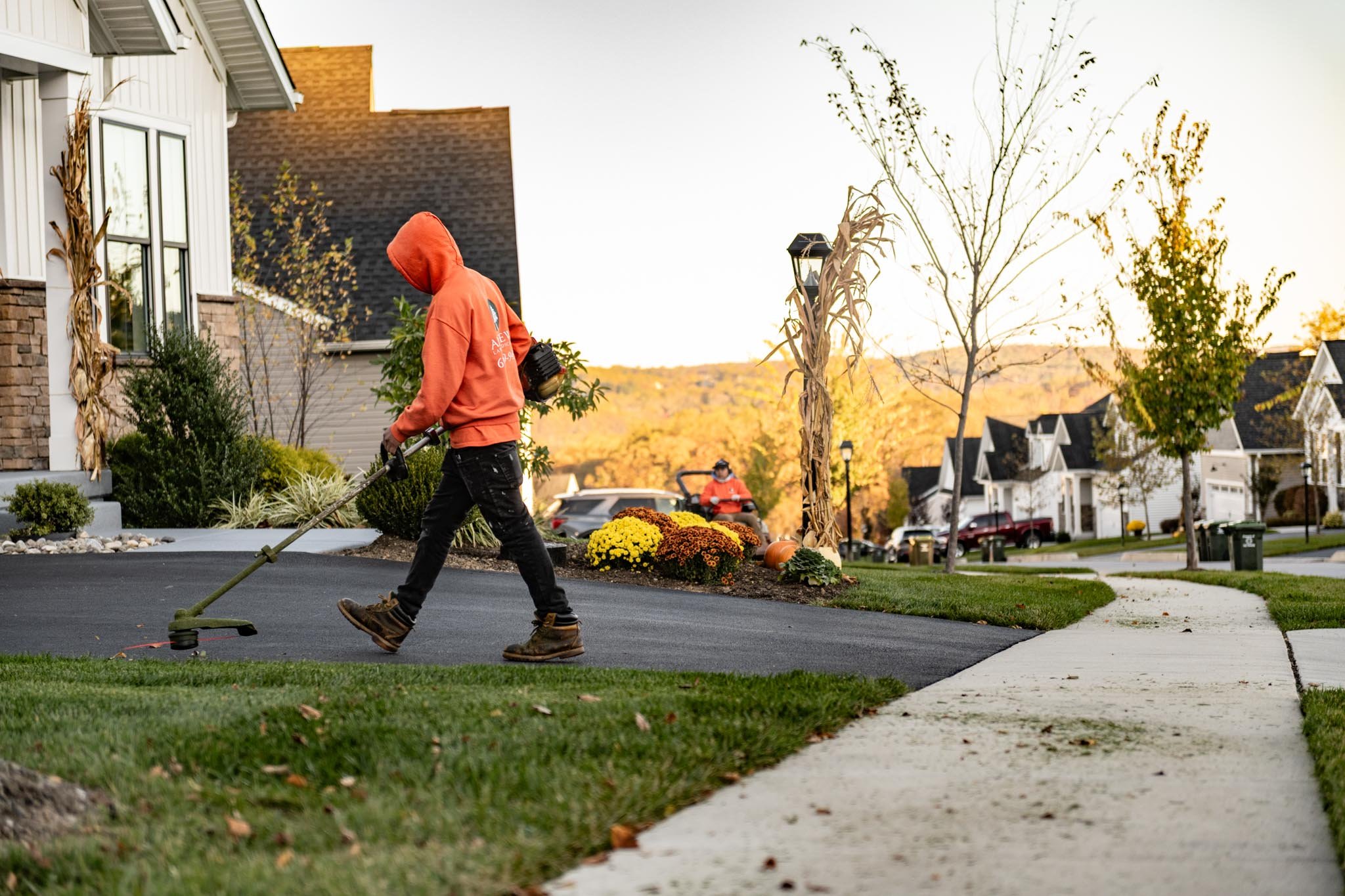 Sidewalk and driveway edging, lawn mowing, residential landscape maintenance