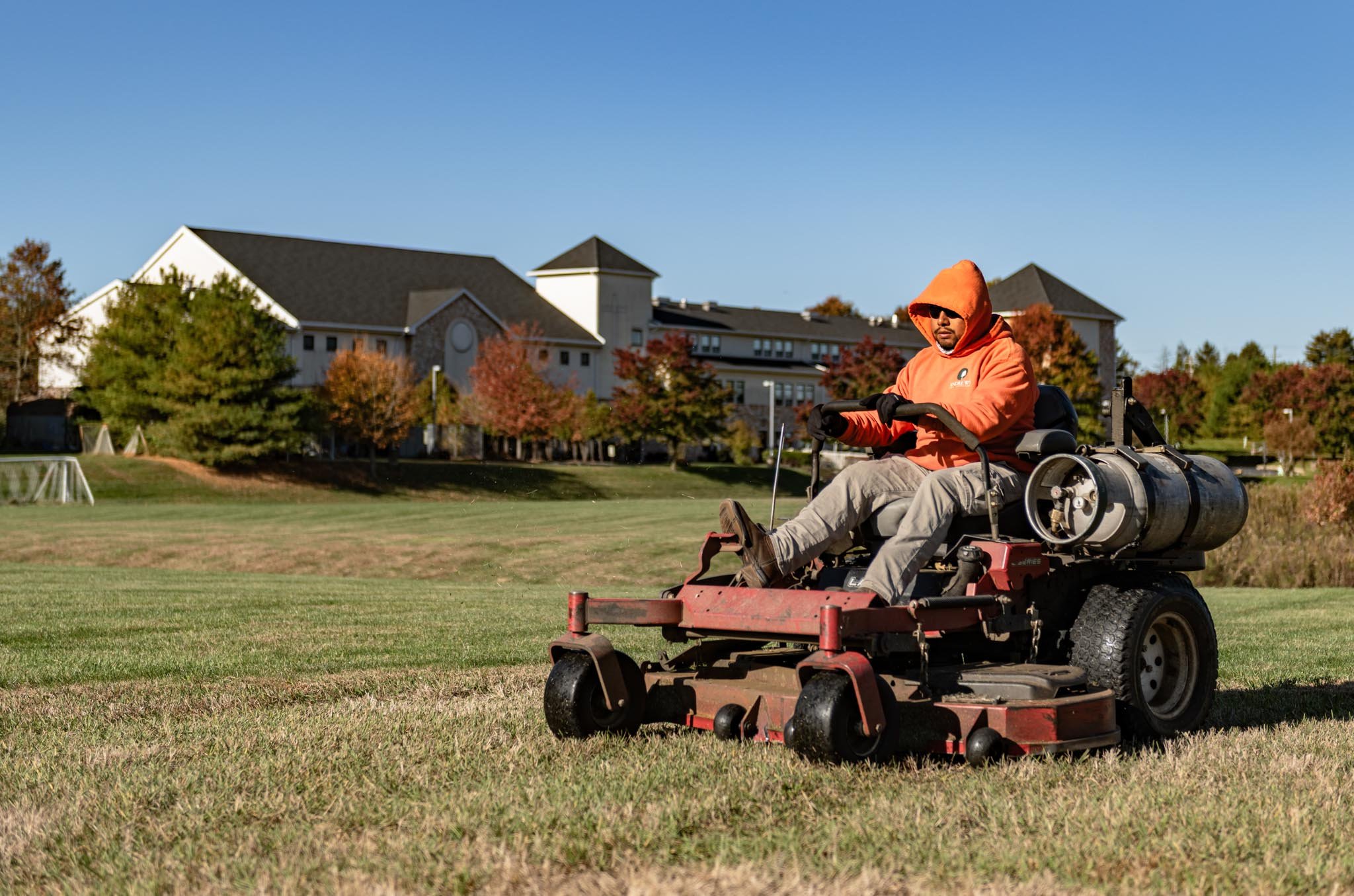 Campus lawn care, grass mowing, landscape maintenance